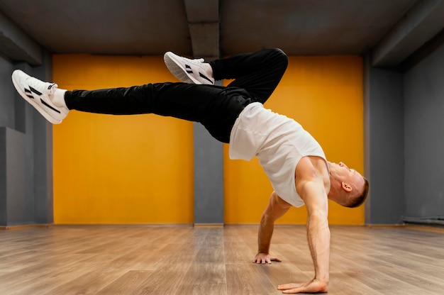 Free Photo man performing breakdance