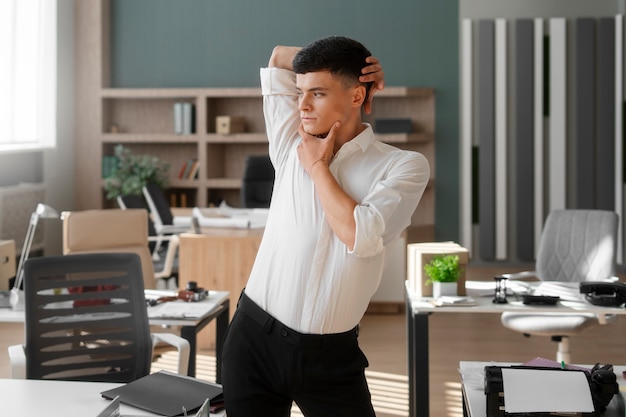 Man performing vogue dance indoors