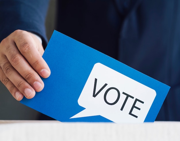 Man placing in a box his ballot