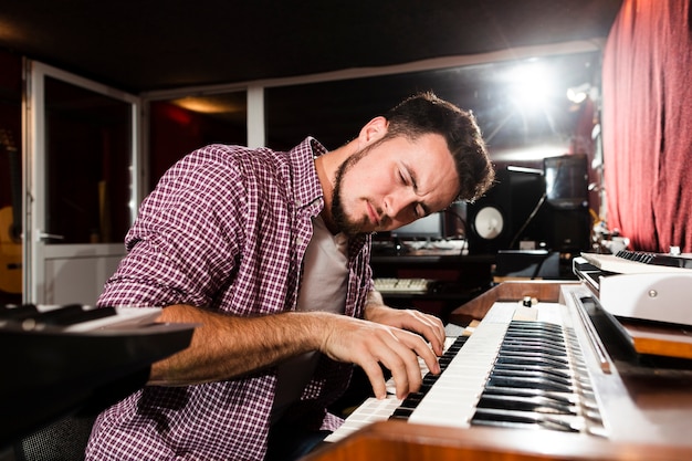 Man playing keyboard and feeling the music