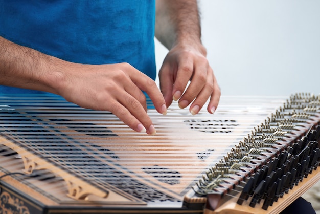 Man playing music at an instrument