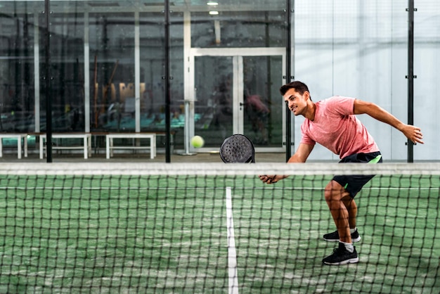 Free photo man playing padel