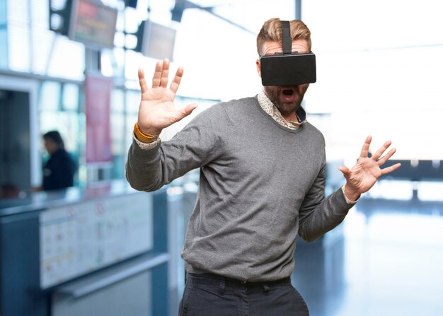 Man playing video games with a virtual reality headset