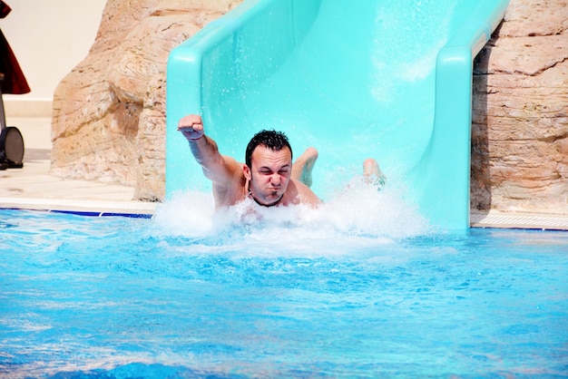 Man playing on the water slide