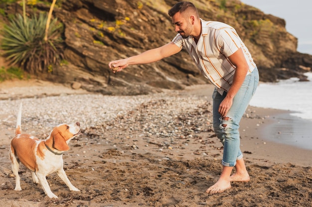 Man playing with dog