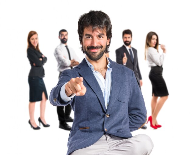 Man pointing to the front over white background