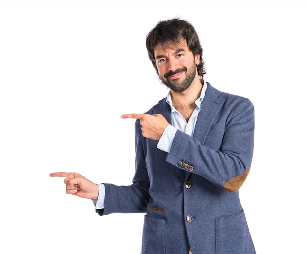 Man pointing to the front over white background