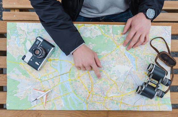 Man pointing at map and navigating