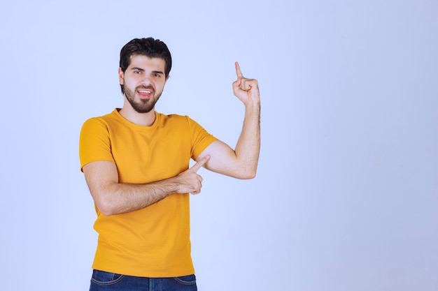 Man pointing up and demonstrating something.