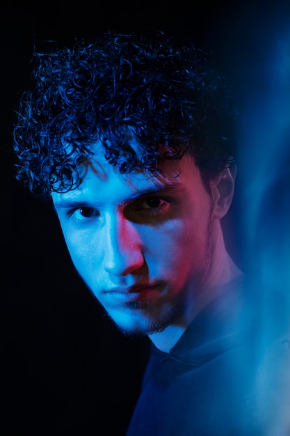 Free photo man portrait with blue lights visual effects