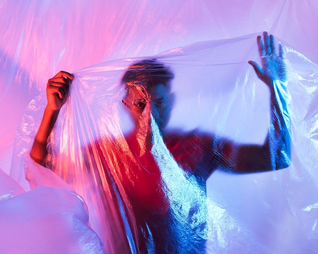 Man posing with plastic foil