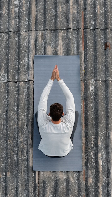 Free photo man practicing yoga mindfulness