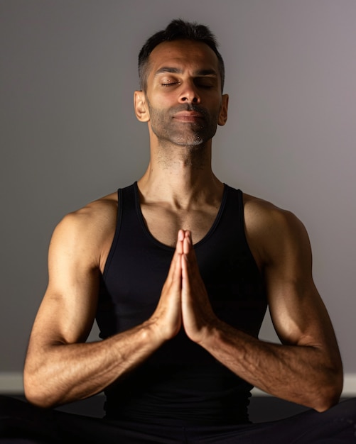 Free photo man practicing yoga mindfulness