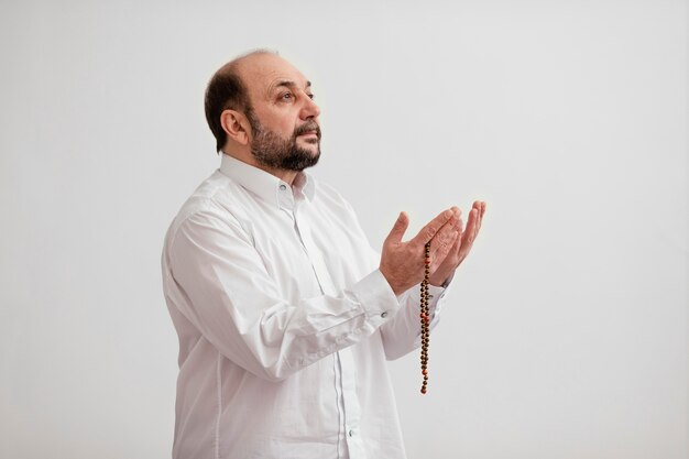 Man praying on the floor indoors