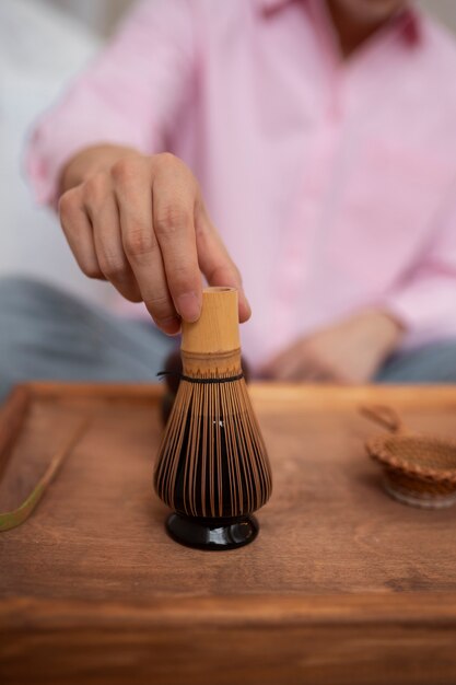 Man preparing matcha tea front view