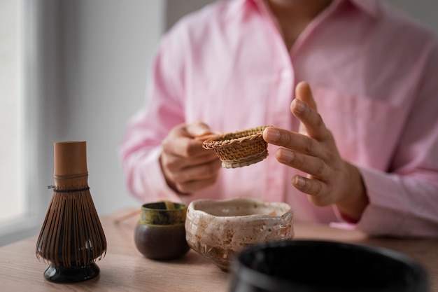 Man preparing matcha tea front view