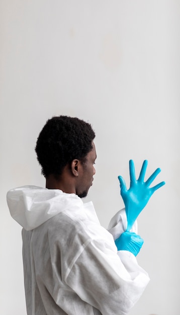 Man putting on protective equipment