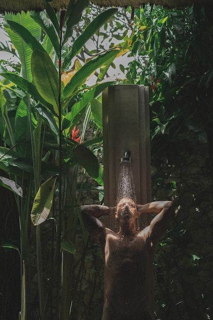 Free photo man in rain shower