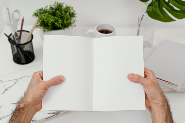 Free Photo man reading a book alone