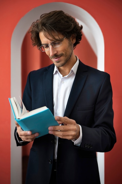 Man reading book indoors front view