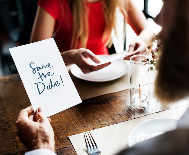 Free photo man reading a wedding invitation card