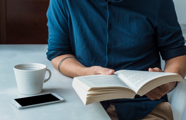 Man reading with coffee