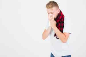 Free photo man in red scarf blowing nose