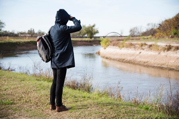 Man relaxing at the river shore