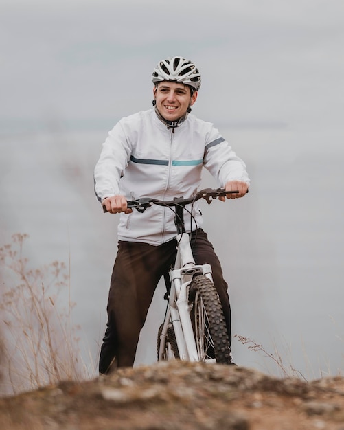 Man riding a bike on a cold day