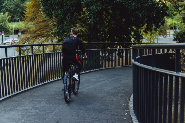 man riding a bike in the park