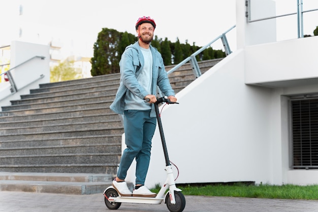 Man riding an eco scooter in the city