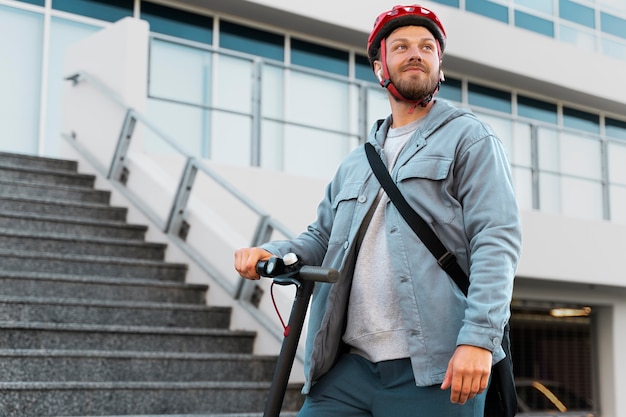 Man riding an eco scooter in the city