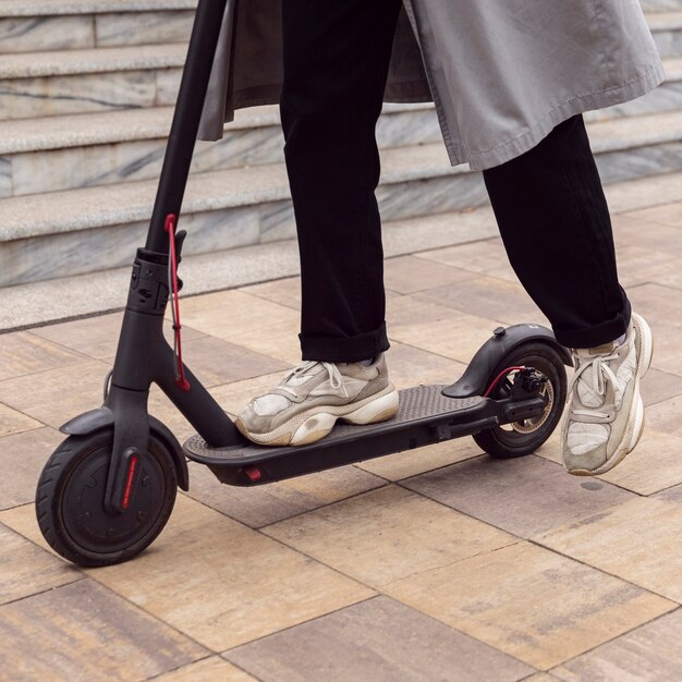 Man riding his electric scooter in the city