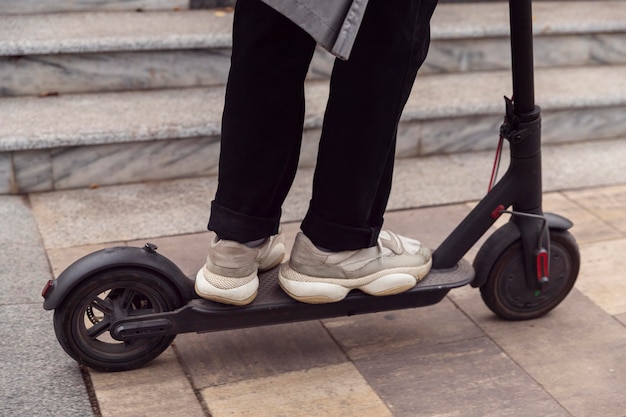 Man riding his electric scooter outdoors