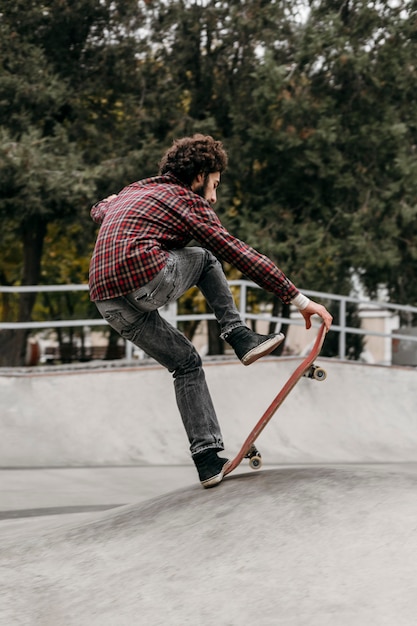 Man riding skateboard outdoors in the park