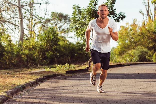 Man runs in the park.