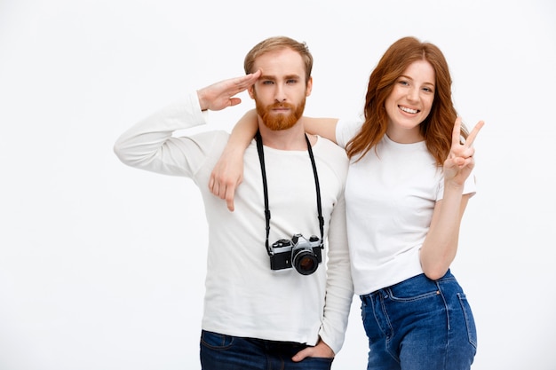 Free photo man saluting while girl hug and smile