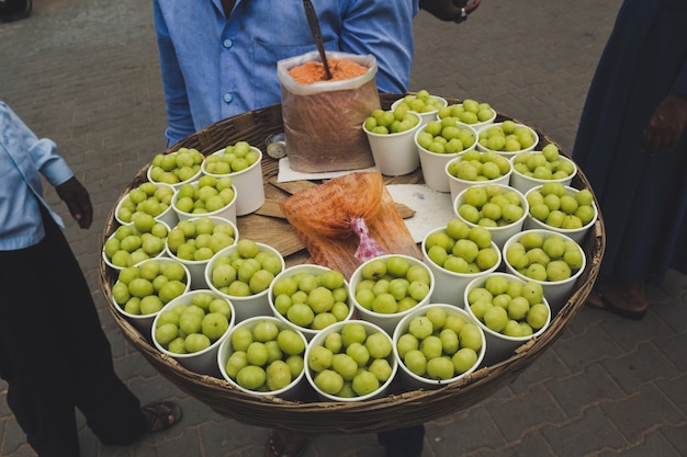 Free photo man selling food on the streets of india