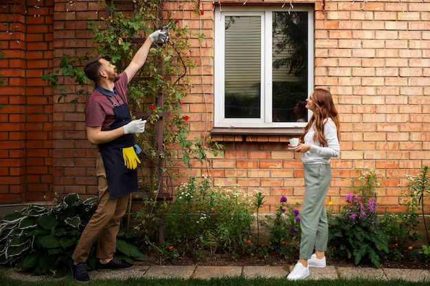 Free Photo man servant caring for the garden