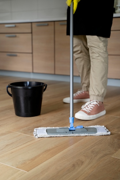 Free photo man servant cleaning the house