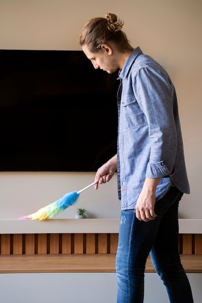 Man servant doing chores around the house