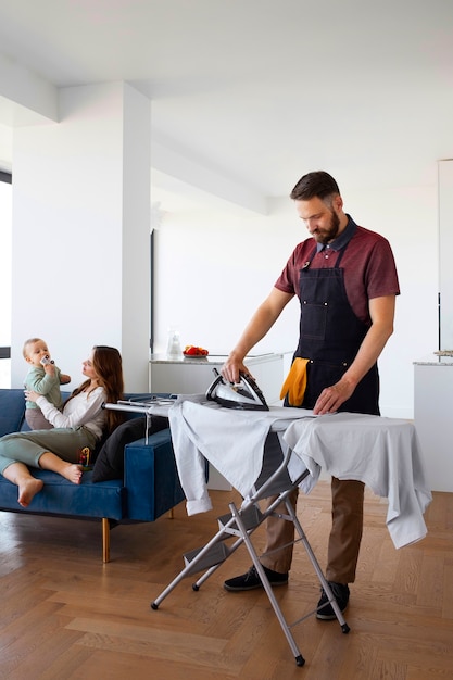 Man servant ironing clothing