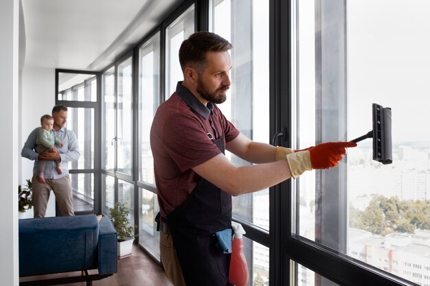 Man servant washing windows