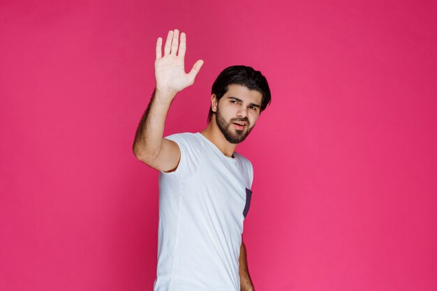 Man shaking hand and greeting someone. 