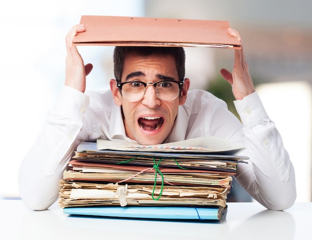 Free Photo man shouting with a pile of papers