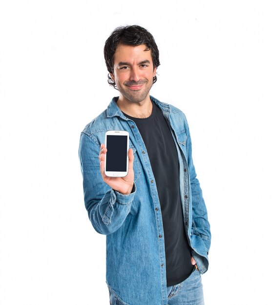 Man showing his mobile over white background