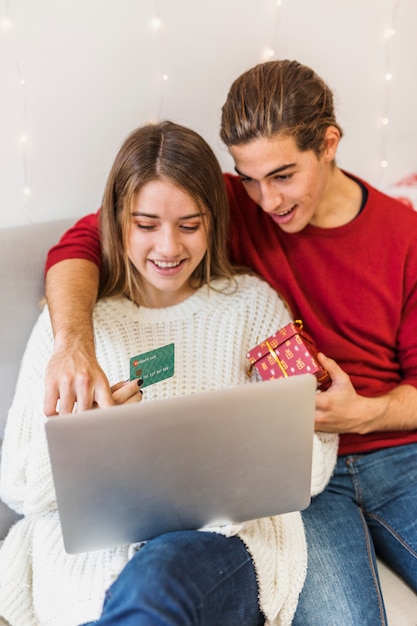 Free Photo man showing at laptop screen with finger 