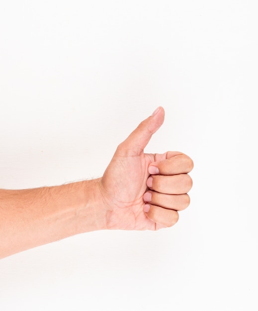 Man showing thumbs up like sign hand gesture. top view.