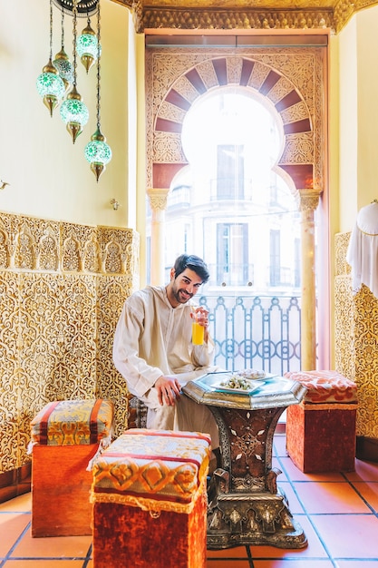 Man sitting in arab restaurant