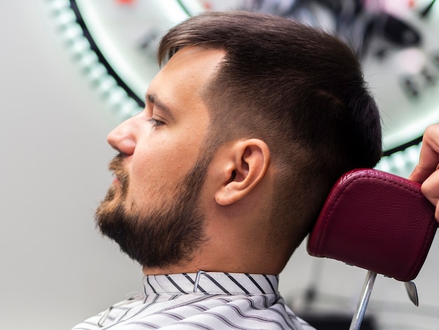 Man sitting in a barber shop